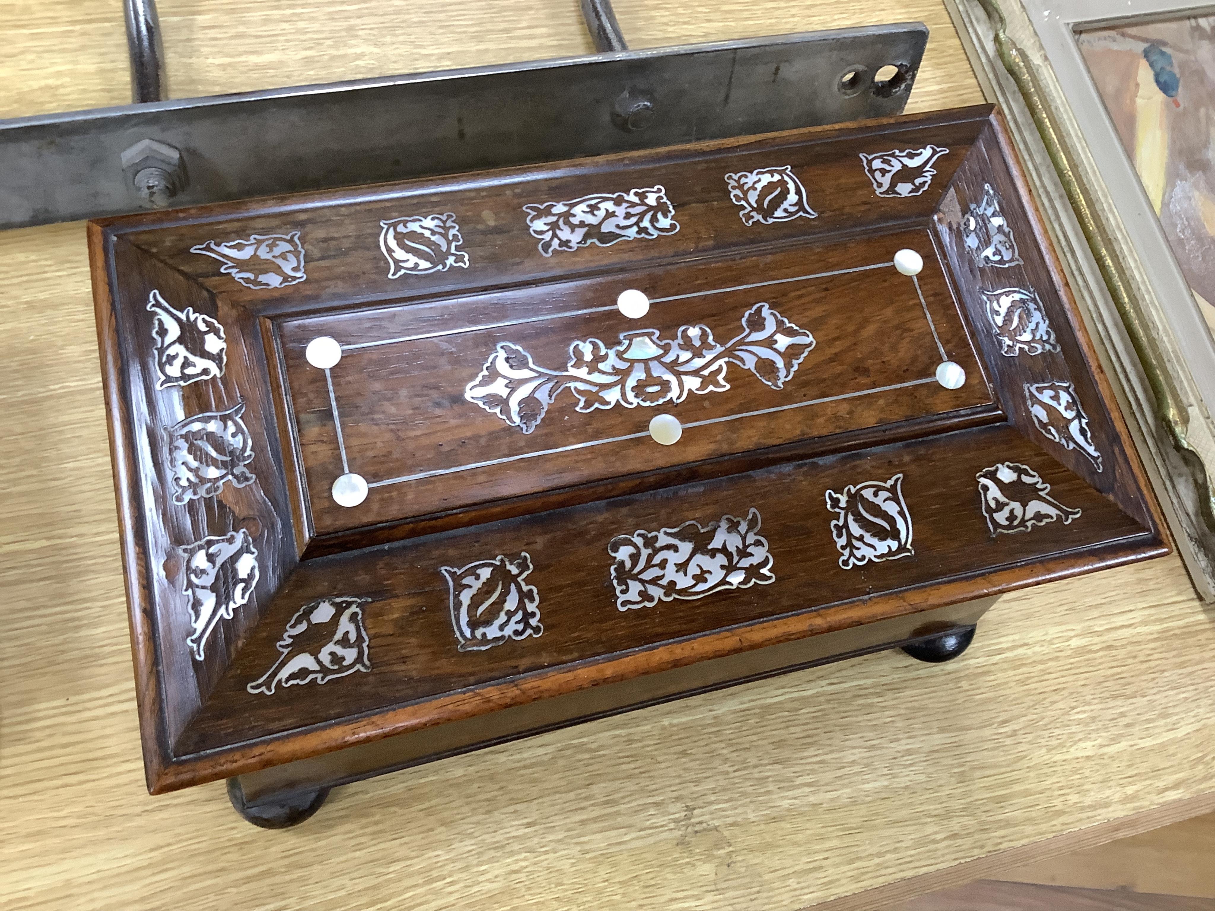 A Victorian rosewood and mother-of-pearl inlaid sarcophagus tea caddy, 39cm wide. Condition - fair